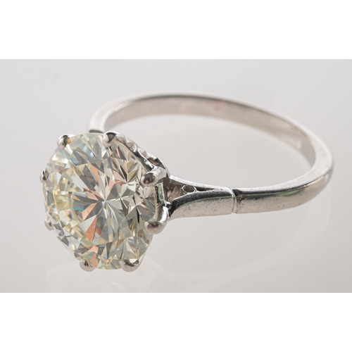 775 - A fine and impressive diamond solitaire ring, eight claw set with a brilliant-cut diamond, diamond a... 