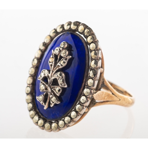 781 - A Victorian enamel and marcasite mourning ring, of oval form with a central plaque of blue enamellin... 