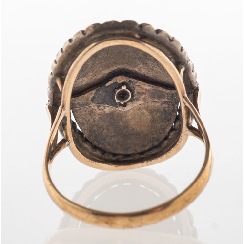 781 - A Victorian enamel and marcasite mourning ring, of oval form with a central plaque of blue enamellin... 