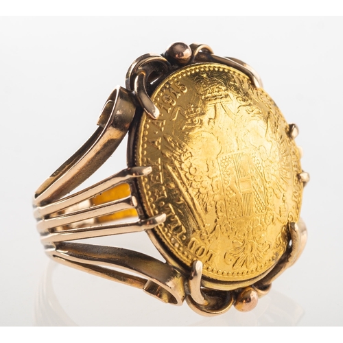 782 - A 1915 Austrian Ducat coin ring, an openwork ring set with a 1915 Austrian Ducat coin, shank indisti... 