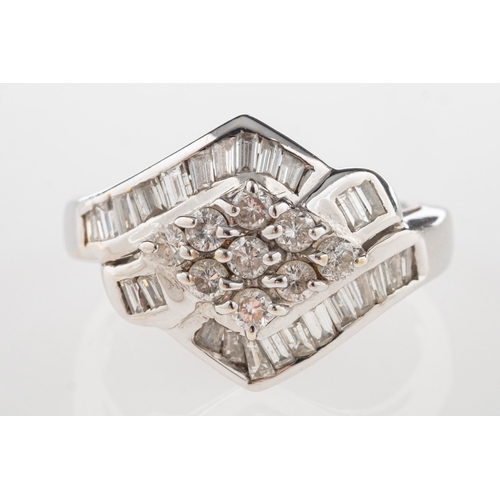 796 - A diamond set ring, a ring set with a mixture of baguette-cut diamonds and brilliant-cut diamonds, d... 