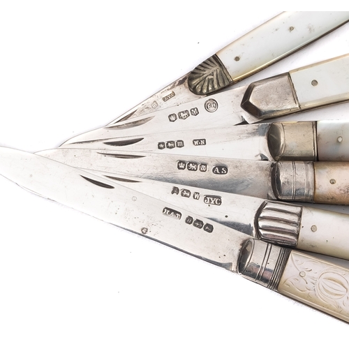 22 - A mixed group 19th century silver and mother of pearl folding fruit knives including; one with carve... 