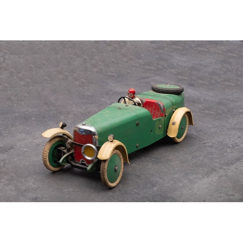 1036 - A Meccano Motor Car, in cream and green with red interior, painted driver figure  and white treaded ... 