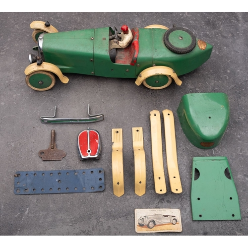 1036 - A Meccano Motor Car, in cream and green with red interior, painted driver figure  and white treaded ... 