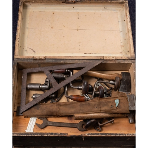 1038 - A collection of various woodworking tools, contained within a pine trunk including braces, awls, an ... 