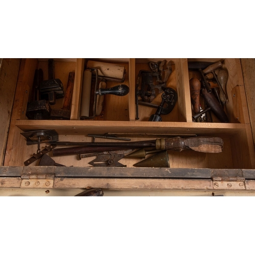 1038 - A collection of various woodworking tools, contained within a pine trunk including braces, awls, an ... 