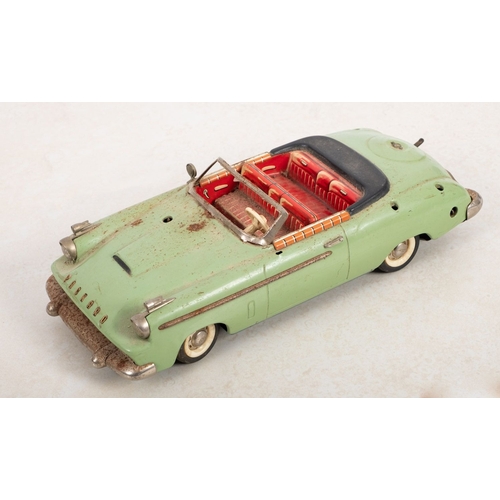 1040 - A Schuco 5700 Syncromatic Packard, pale green with litho printed interior,  (incomplete)