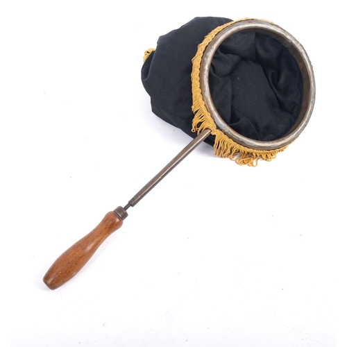 1060 - A mid 20th century magician's bag trick. Having a metal frame with black felt bag and gold tassles, ... 