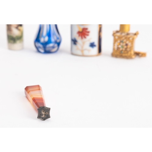 1083 - A collection of Victorian and later snuff bottles. Comprising a blue glass example and another with ... 