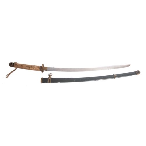 135 - An early 20th century katana, the slightly curved single edge blade with brass habki and gilt brass ... 