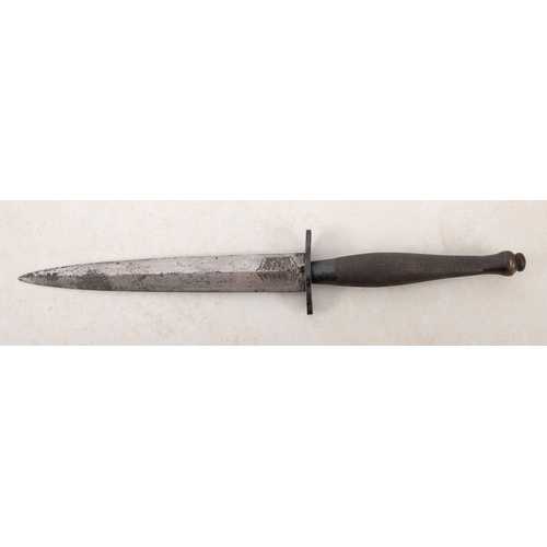 142 - A Fairbairn Syke fighting knife by Wilkinson Sword Co Ltd of London. Second pattern circa 1941, the ... 