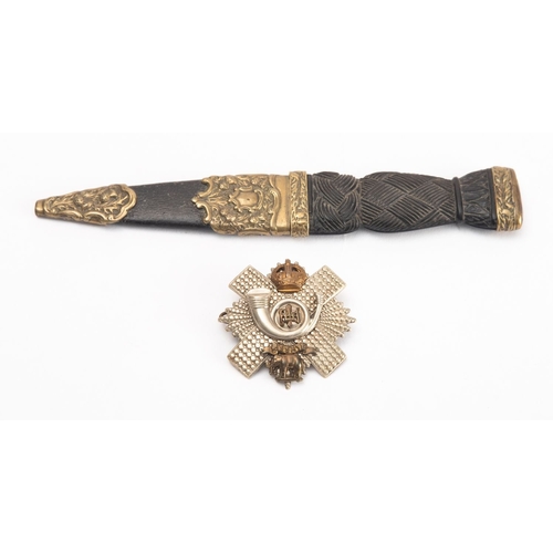 144 - An early 20th century Sgian Dubh, the short blade with rope knot bog oak grip and plated mounts with... 