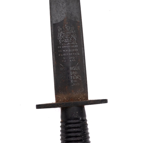 162 - A Wilkinson Sword Fairburn Sykes third pattern fighting knife. Post WWII having a ribbed metal handl... 