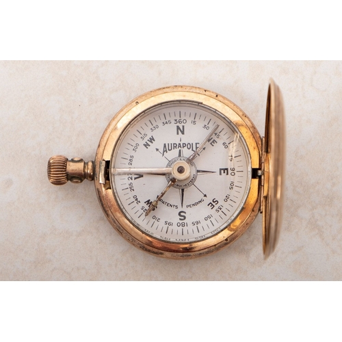 186 - An early 20th century Short and Mason Aurapole brass cased pocket compass. The case opening to revea... 