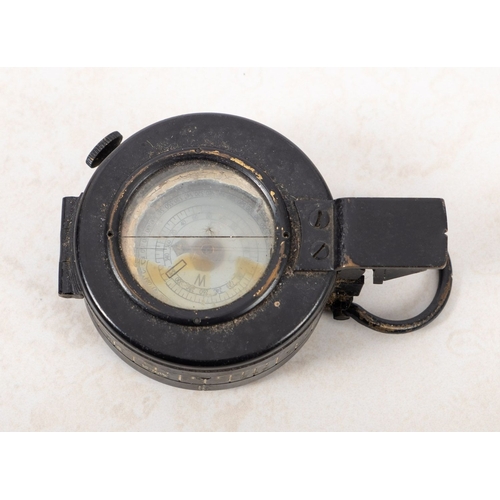 190 - A 1940 Mk III T.G Colts of London military compass. Serial number B38396, having a black metal case ... 