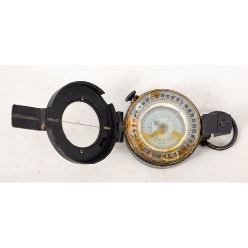 190 - A 1940 Mk III T.G Colts of London military compass. Serial number B38396, having a black metal case ... 