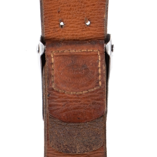 193 - A German army belt and three armbands. The black leather belt with silver stamped buckle, stamped 19... 