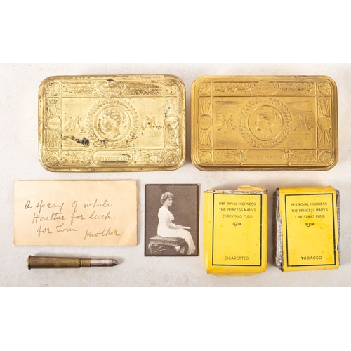 194 - Two 1914 Princess Mary Christmas tins. One containing cigarettes, tobacco and a photograph of a fema... 