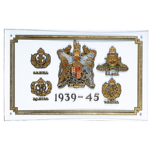 211 - A gilt glass panel commemorating the Hill family in WWII. Having the Royal coat of arms to the centr... 