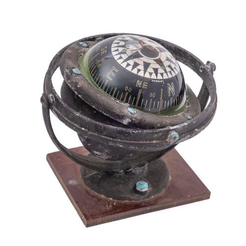 219 - A mid-20th century German 3 inch liquid filled gimballed compass, unsigned, mounted on a later plast... 