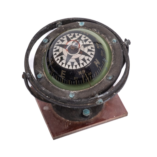 219 - A mid-20th century German 3 inch liquid filled gimballed compass, unsigned, mounted on a later plast... 