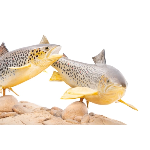 3 - A ceramic fish sculpture by Ian J Greensitt, showing a pair of hand painted Brown Trout set on a scu... 