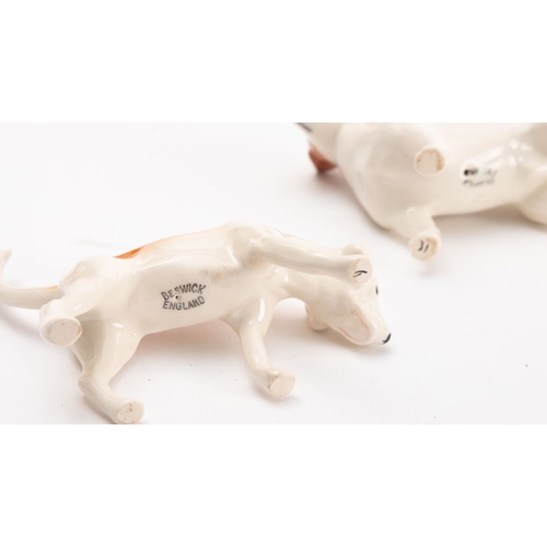 39 - Two Beswick ceramic figures of dogs. Comprising a Hound and a Terrier.