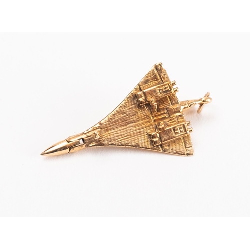 48 - A 9ct gold Concorde pendant, with lowered landing gear and  hinged cockpit, 5.9g. 4cm long..