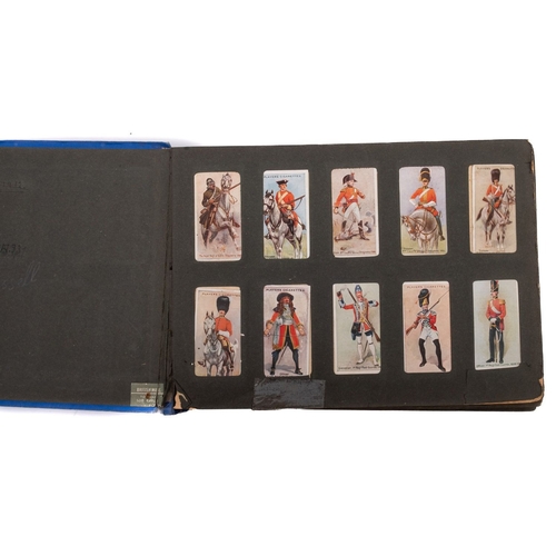 567 - A collection of sets and part sets of cigarette cards in a blue album. Including Gallaher Ltd Aeropl... 