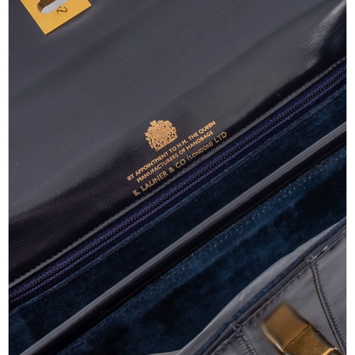 675 - S Launer & Co. A black leather evening bag with gilt hardware and blue suede interior, together with... 