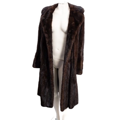 683 - An early 20th century Debenham & Freebody full length fur coat,  signed as per title with silk linin... 