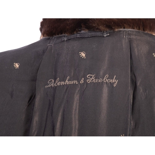 683 - An early 20th century Debenham & Freebody full length fur coat,  signed as per title with silk linin... 