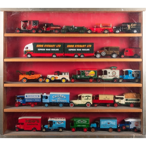 813 - A collection of diecast vehicles in three display cabinets. Comprising Corgi, Matchbox and Lledo lor... 