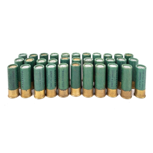 83 - A collection of 12 bore paper cartridges, mostly Eley  with various retailers  to cases, together in... 