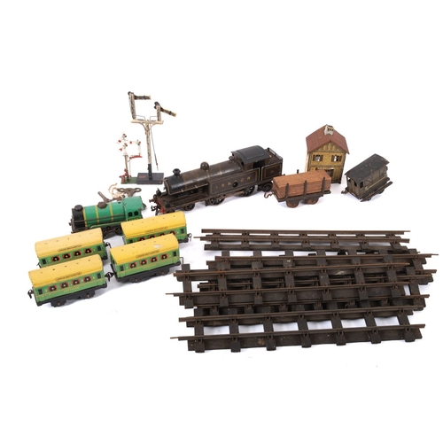 859 - An O gauge Bassett Lowke or similar LB&SCR 4-6-2 clockwork tank engine. In brown with black trim and... 