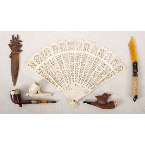 987 - A mixed collection of Stanhopes. Three pipes including one showing Scarborough, a bone handled fan s... 