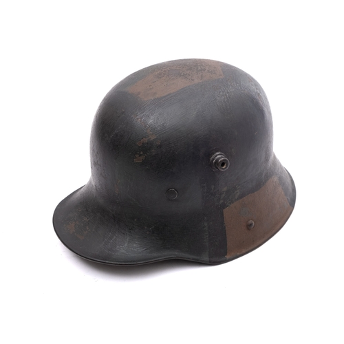 166 - A WWI period German M1916 Stahlhelm, hand painted camouflage finish with white leather liner, the he... 