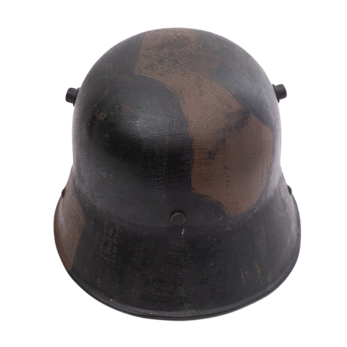 166 - A WWI period German M1916 Stahlhelm, hand painted camouflage finish with white leather liner, the he... 