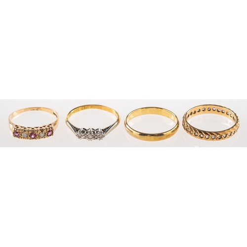 872 - A group of four rings, including a 9ct gold half eternity style ring set with alternating circular-c... 