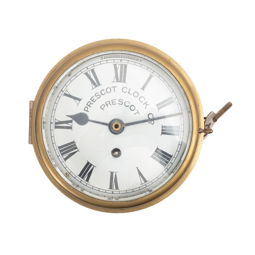 An early 20th century brass bulkhead clock, maker Prescot Clock Co. the ...