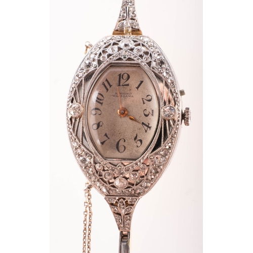 366 - A gold and white metal diamond set lady's cocktail watch the cushion-shaped silvered dial having bla... 