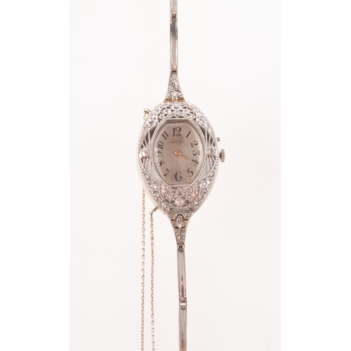 366 - A gold and white metal diamond set lady's cocktail watch the cushion-shaped silvered dial having bla... 