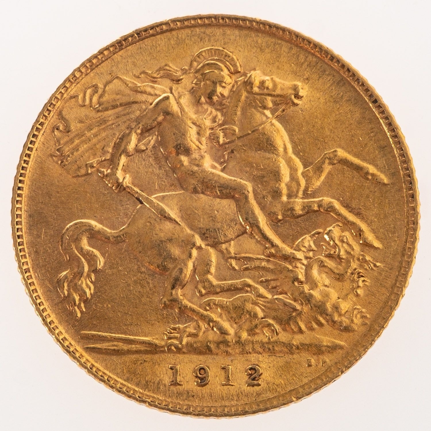 A George V Half Sovereign, bare bust, reverse. St George and the Dragon ...