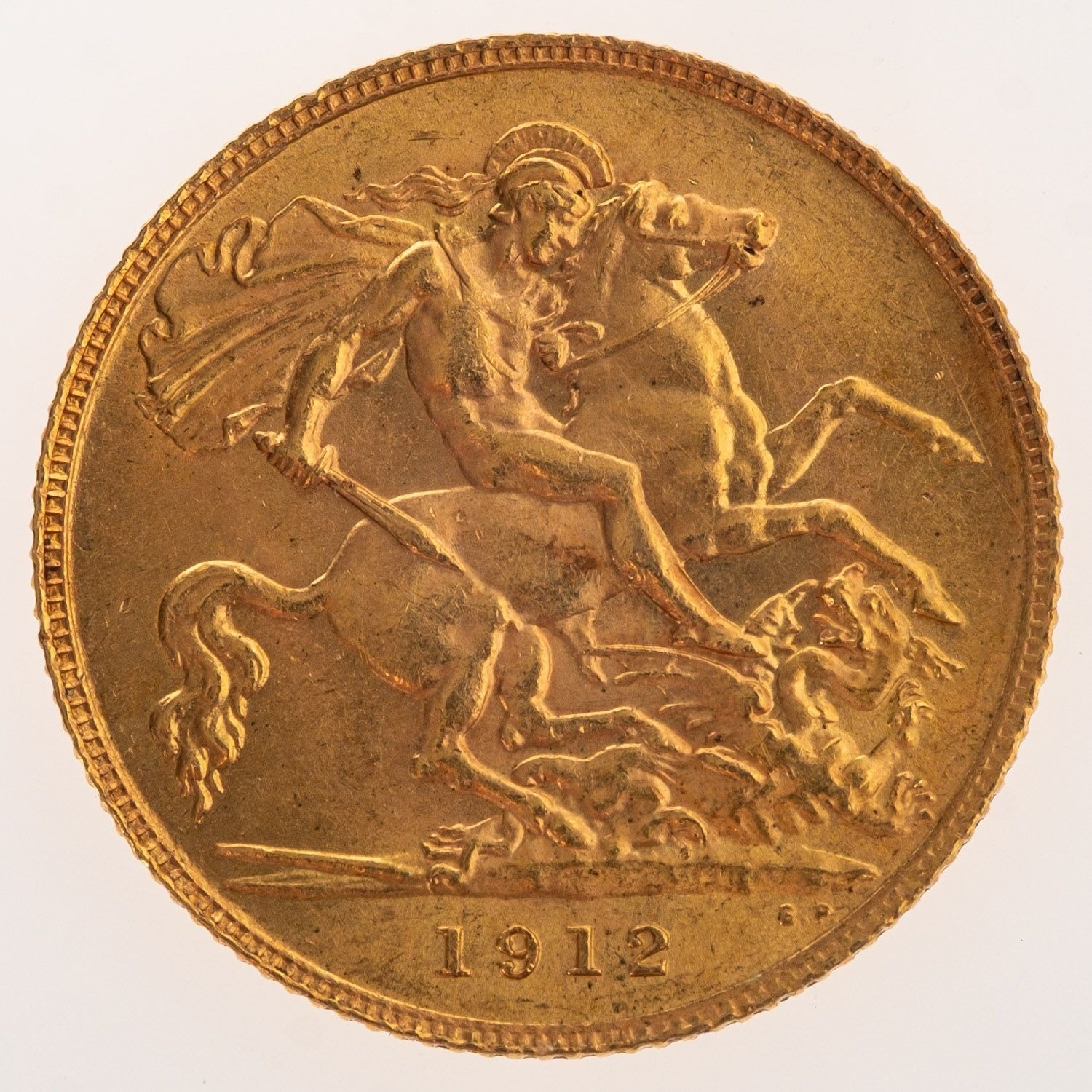 A George V Half Sovereign, bare bust, reverse. St George and the Dragon ...