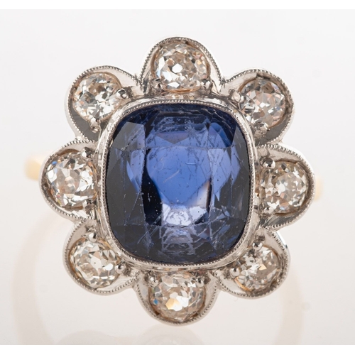 A sapphire and diamond cluster ring, of flowerhead form, milgrain ...