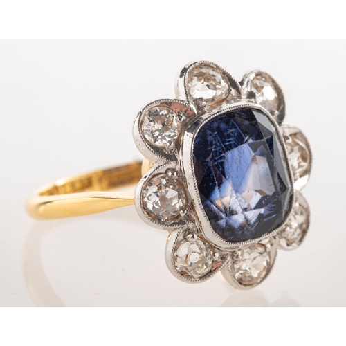 A sapphire and diamond cluster ring, of flowerhead form, milgrain ...