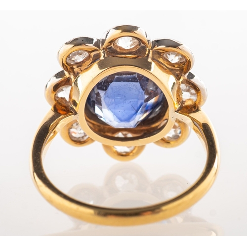 A sapphire and diamond cluster ring, of flowerhead form, milgrain ...