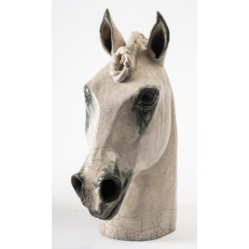 1 - Catriona McLeod [b 1946] a raku fired stoneware sculpture, of a horses head with plaited mane, 29.5c... 
