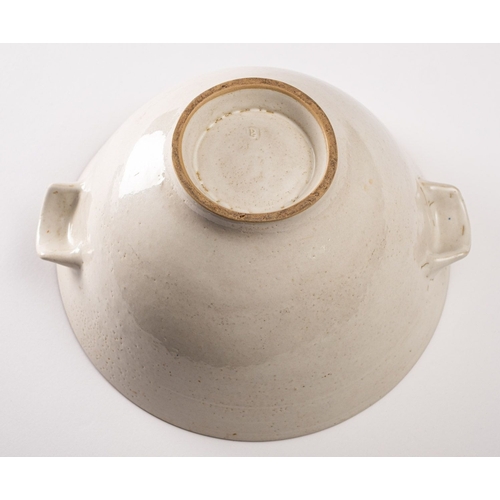 31 - *Dame Lucie Rie DBE [1902-1995] a large white stoneware bowl, with lug handles the pitted off white ... 