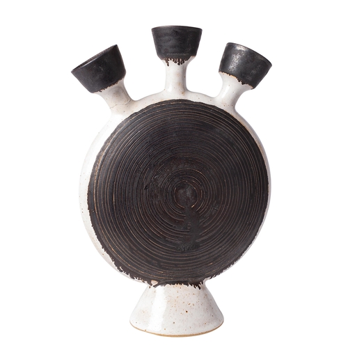 36 - *Dame Lucie Rie DBE [1902-1995] a stoneware composite bottle, the disc shaped body with triple necks... 